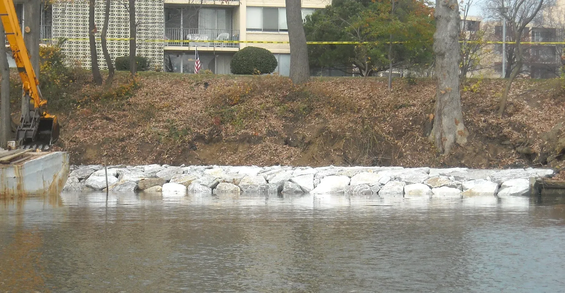 New stone revetment in front of a waterfront building